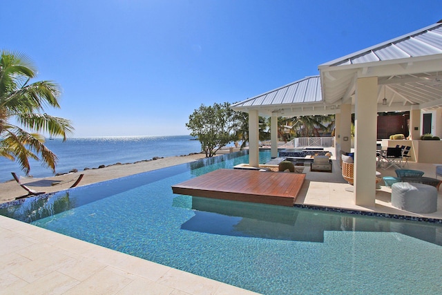 30 Ocean Front Dr, Key Largo, FL 33037 - view of swimming pool featuring a gazebo, an outdoor hangout area, and a water view