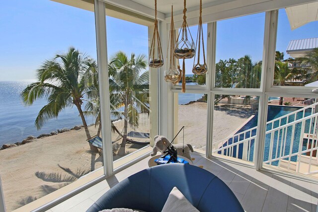 30 Ocean Front Dr, Key Largo, FL 33037 - sunroom with a water view and plenty of natural light
