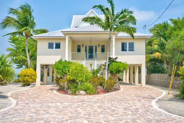 view of front of home featuring a carport and a porch