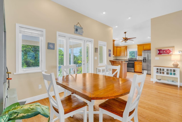 dining room featuring light hardwood / wood-style flooring and ceiling fan