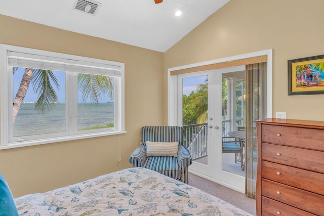 carpeted bedroom featuring access to outside, french doors, and vaulted ceiling