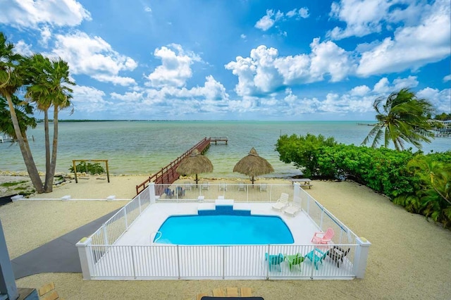 view of pool featuring a water view