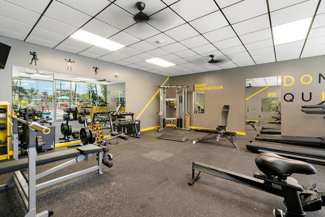 workout area with a paneled ceiling