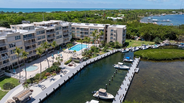 birds eye view of property featuring a water view