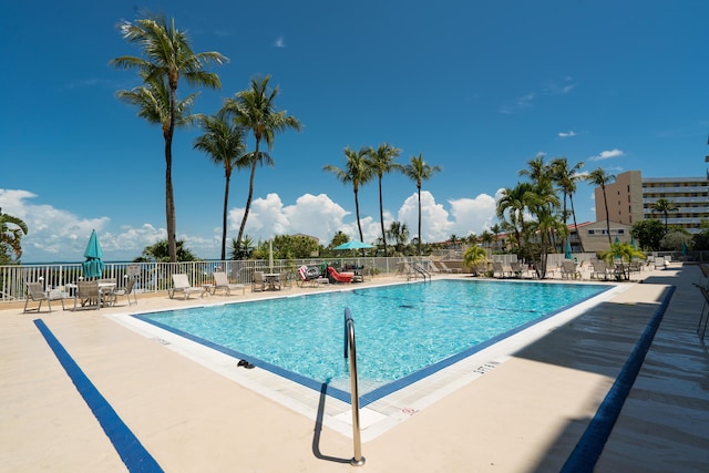 view of swimming pool with a patio