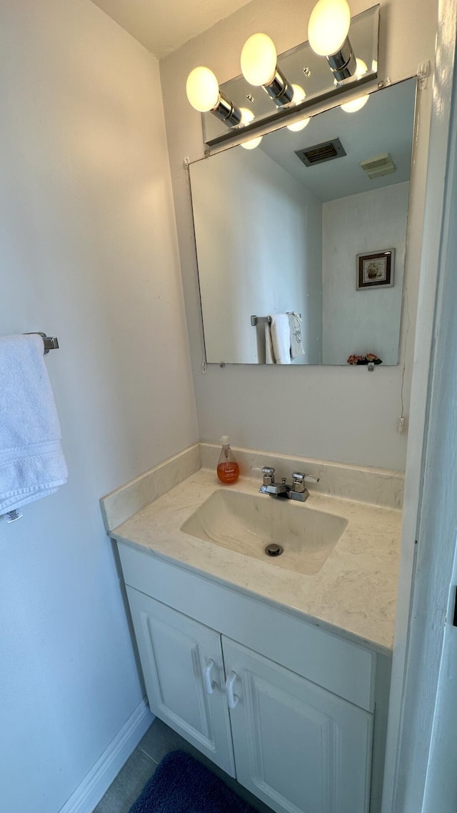 bathroom featuring vanity and tile patterned flooring