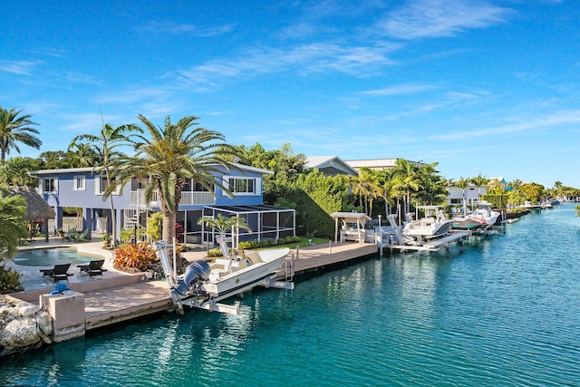 exterior space with glass enclosure and a water view