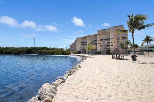 view of swimming pool with a gazebo and a water view