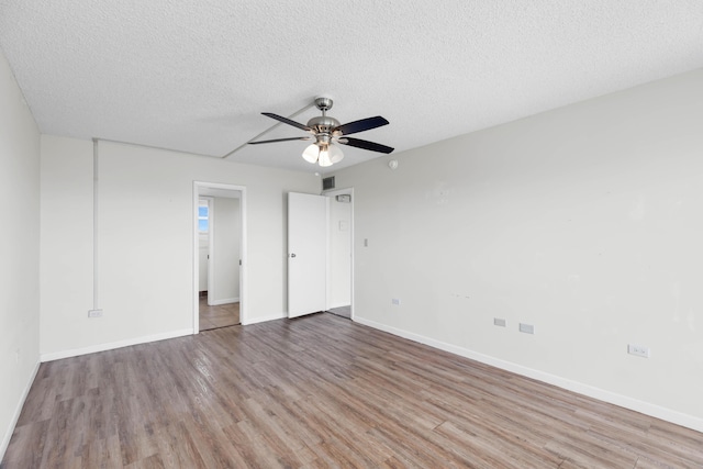 unfurnished bedroom with ceiling fan, light hardwood / wood-style floors, and a textured ceiling