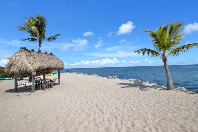 property view of water featuring a gazebo and a view of the beach