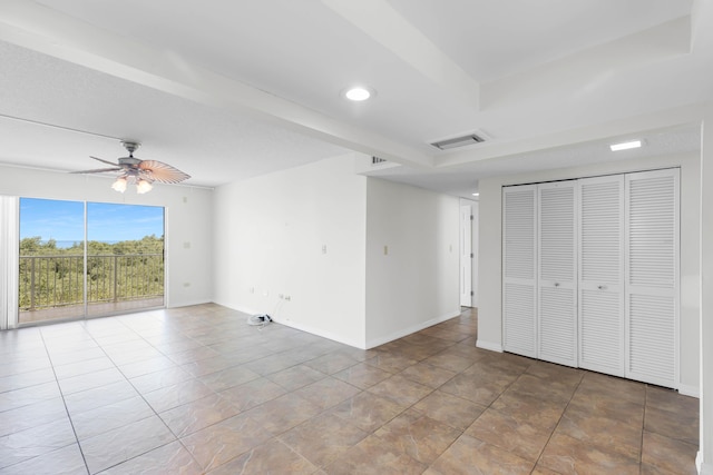 unfurnished bedroom featuring ceiling fan, access to exterior, a closet, and light tile patterned floors