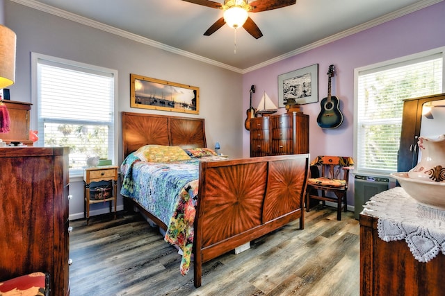 bedroom with multiple windows, ornamental molding, and wood finished floors