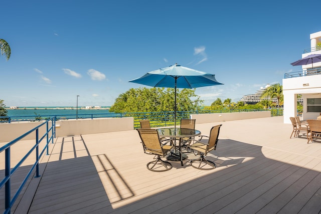 105 Front St Unit 119, Key West, FL 33040 - wooden terrace featuring outdoor dining area and a water view