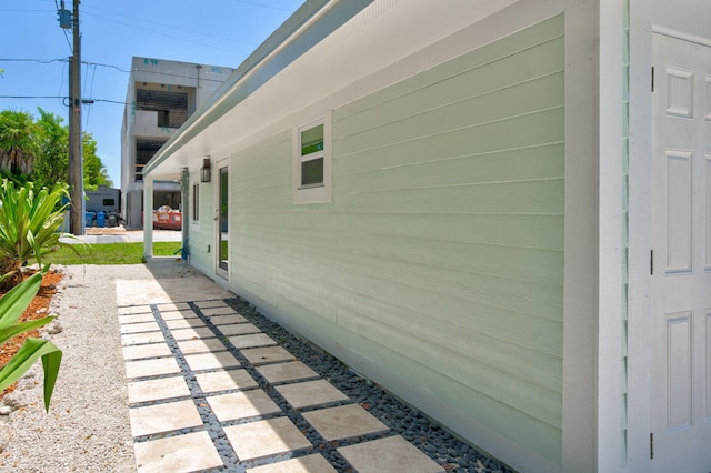 view of side of property with a patio area