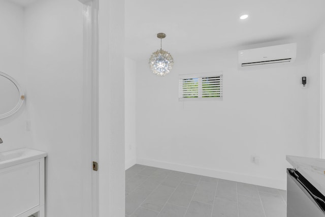 interior space with a wall mounted air conditioner and vanity