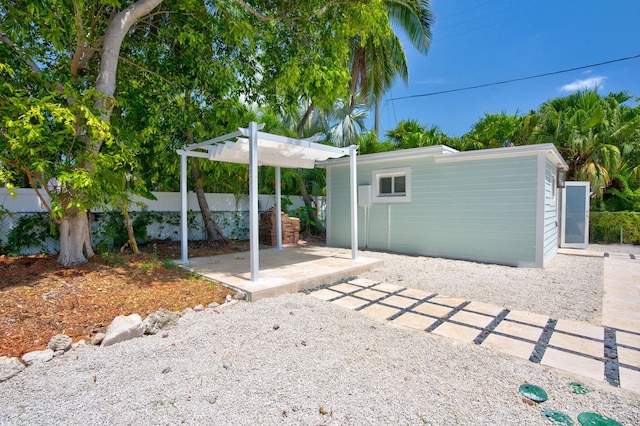 exterior space featuring a patio area and a pergola