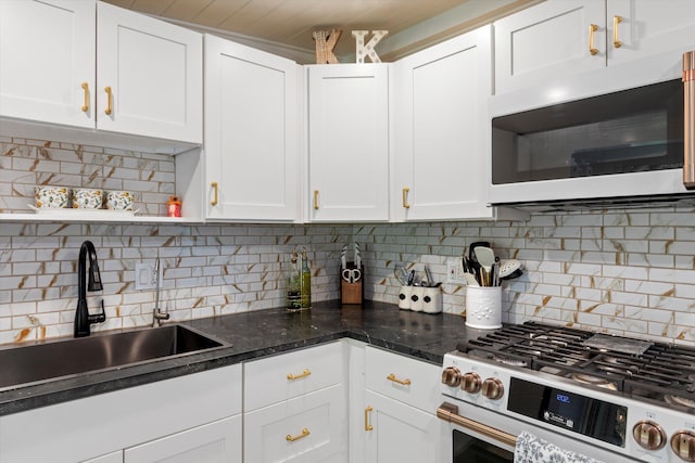 1030 James St, Key West, FL 33040 - kitchen with white gas range oven, a sink, white cabinetry, backsplash, and open shelves