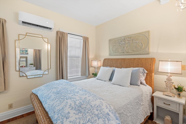 1030 James St, Key West, FL 33040 - bedroom with a wall mounted air conditioner, wood finished floors, and baseboards