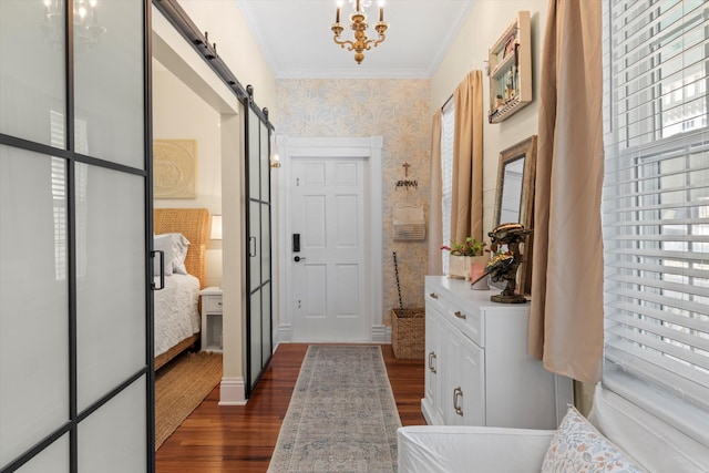 1030 James St, Key West, FL 33040 - entryway with wallpapered walls, a barn door, dark wood-style flooring, ornamental molding, and a chandelier