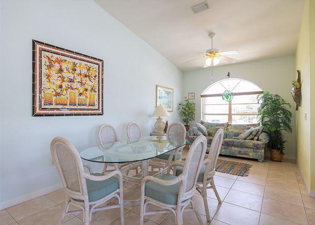 tiled dining space featuring ceiling fan