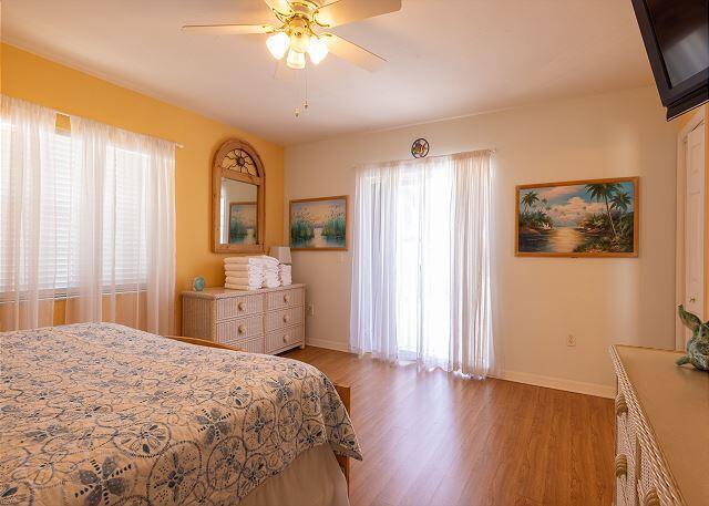 bedroom featuring light hardwood / wood-style flooring and ceiling fan