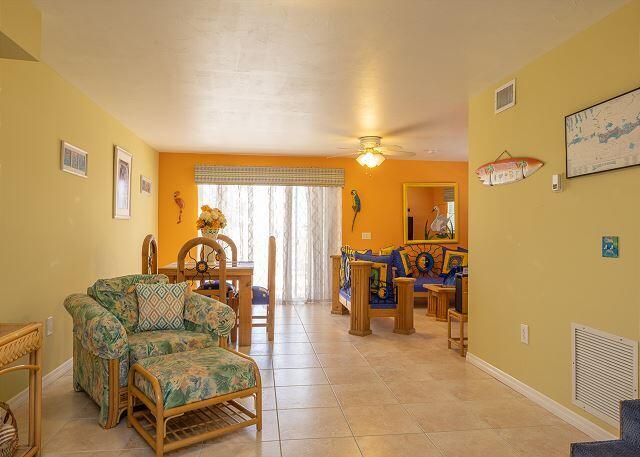 sitting room with light tile patterned floors and ceiling fan