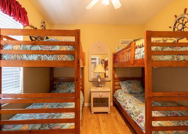 bedroom with wood-type flooring and ceiling fan