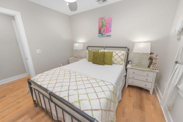 bedroom with ceiling fan and light wood-type flooring