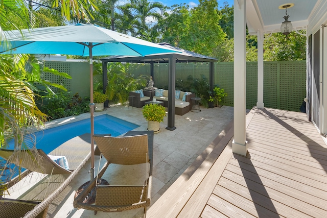 view of pool featuring a gazebo, an outdoor hangout area, and a patio area