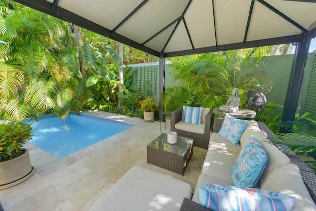 view of swimming pool featuring outdoor lounge area and a patio