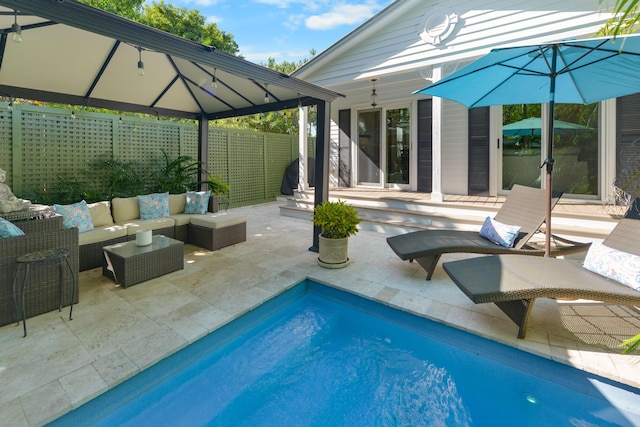 view of pool with a gazebo, an outdoor hangout area, and a patio area