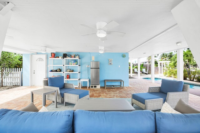 view of patio featuring ceiling fan and outdoor lounge area