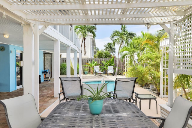 view of patio with a fenced in pool and a pergola