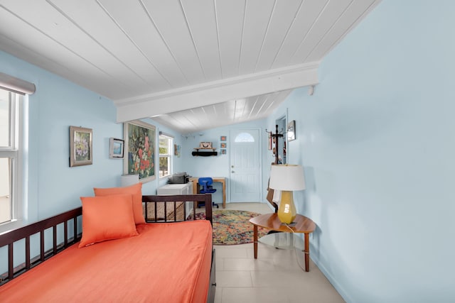 bedroom with beamed ceiling and wooden ceiling