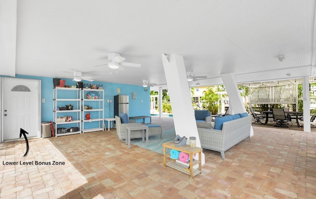 view of patio featuring an outdoor living space and ceiling fan