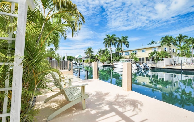 exterior space featuring a water view and a boat dock