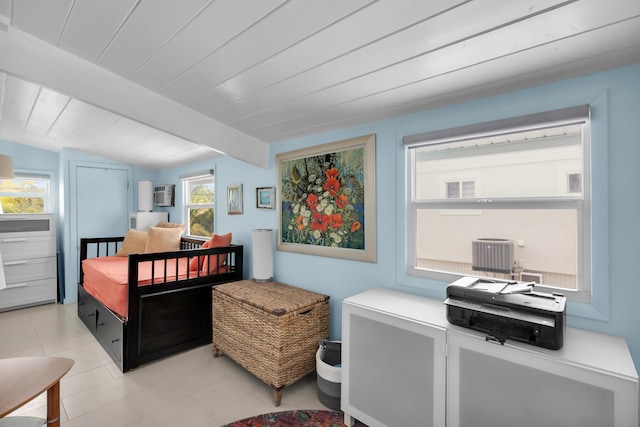 bedroom with beamed ceiling and wooden ceiling