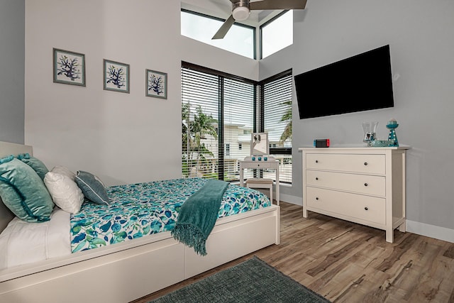 bedroom featuring ceiling fan and light hardwood / wood-style flooring