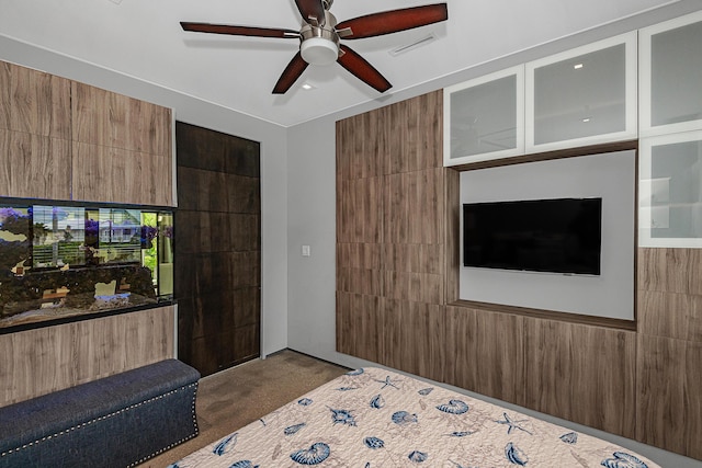 bedroom with dark colored carpet and ceiling fan