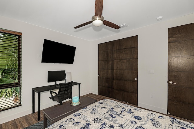 bedroom featuring dark wood-type flooring and ceiling fan