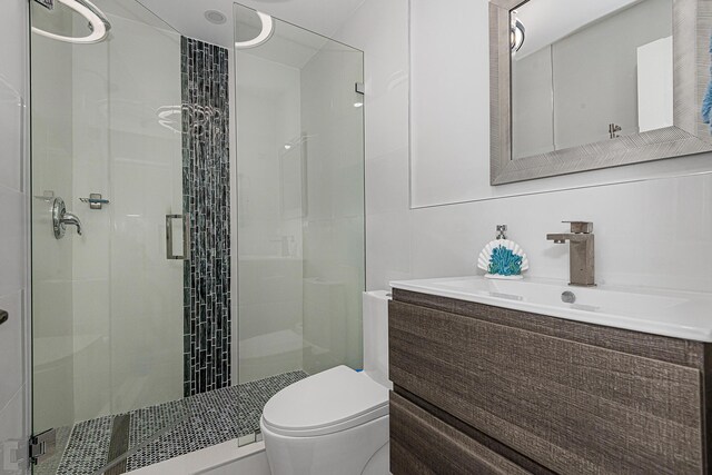 68 Mutiny Pl, Key Largo, FL 33037 - bathroom with vanity, a shower with shower door, and toilet
