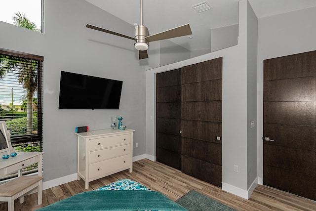 bedroom with lofted ceiling and light hardwood / wood-style flooring