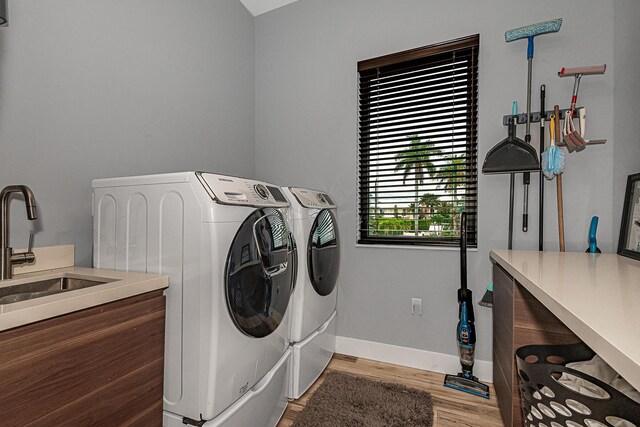 68 Mutiny Pl, Key Largo, FL 33037 - laundry room with sink, hardwood / wood-style flooring, and washer and clothes dryer