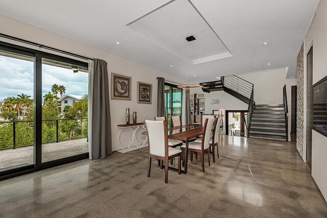68 Mutiny Pl, Key Largo, FL 33037 - dining room with a tray ceiling and concrete floors