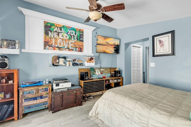 bedroom featuring ceiling fan and light wood-type flooring