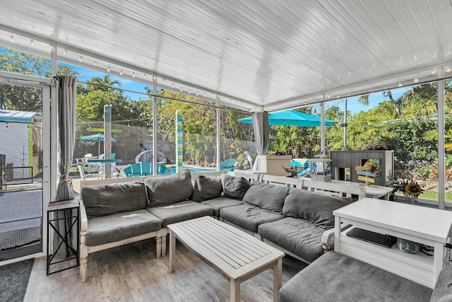 sunroom / solarium featuring plenty of natural light