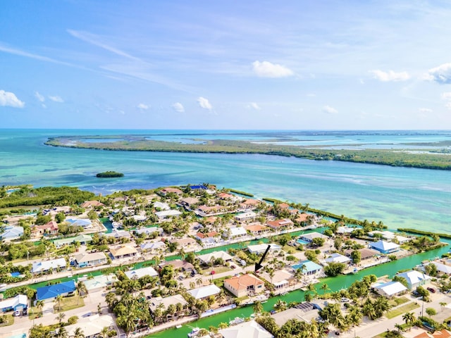 birds eye view of property featuring a water view and a residential view
