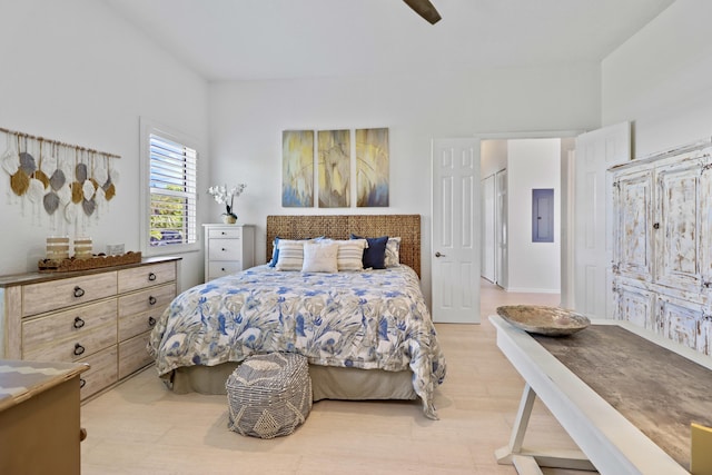 bedroom with light wood-type flooring and ceiling fan
