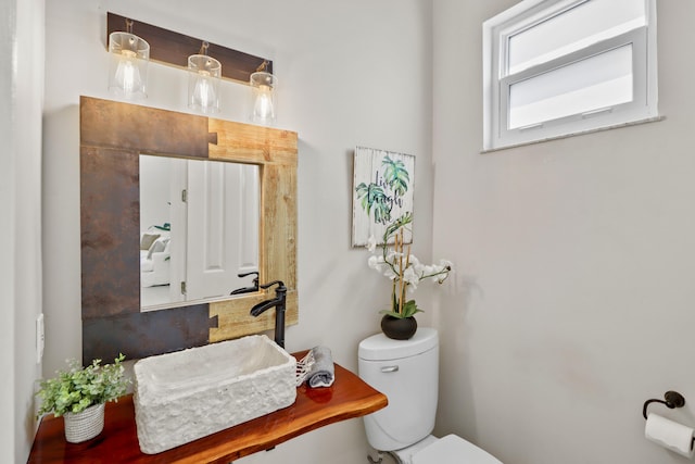 half bath featuring toilet