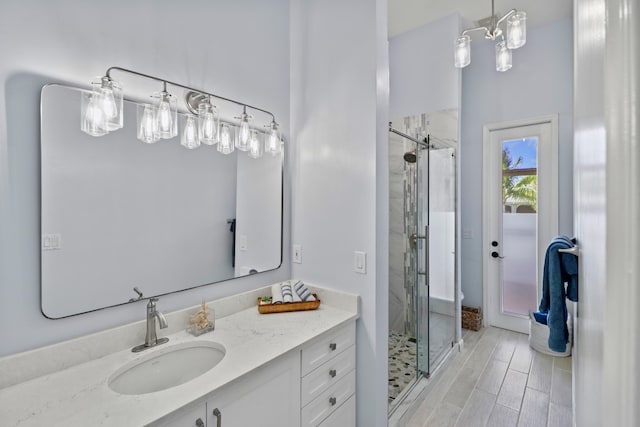 bathroom featuring a stall shower and vanity